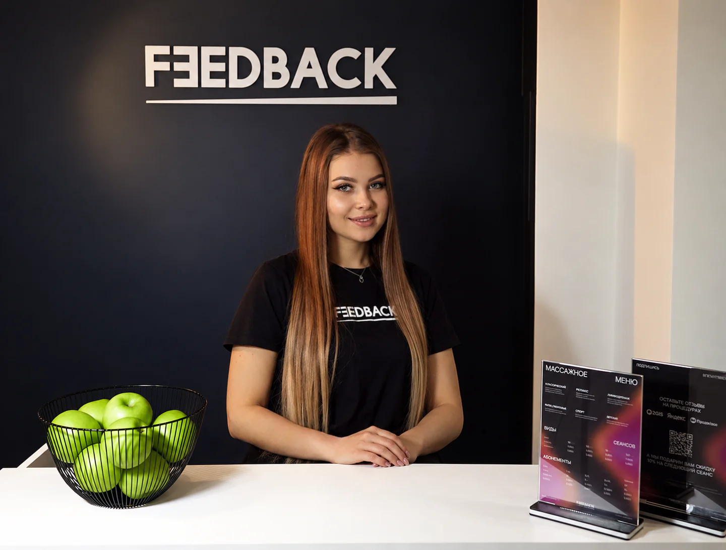 Feedback studio on Chistopolskaya 9B — lounge with a neon sign