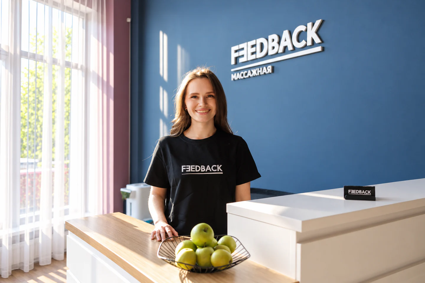 Feedback studio on Maksima Gorkogo 43 — guest by the neon-lit mirror